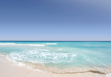 waves breaking onto the beach