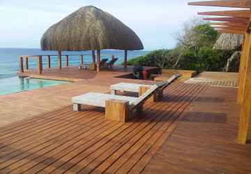 swimming pool and thatched gazebo overlooking ponta mamoli beach