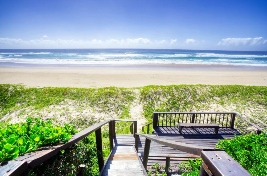 view of the sea from the walkway at Baleia Azul 26 in Ponta Mamoli