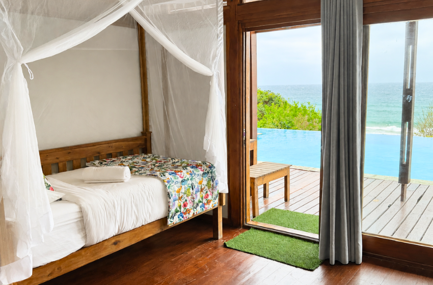 bedroom 1 with sea view at Aloha 18 in Ponta Mamoli