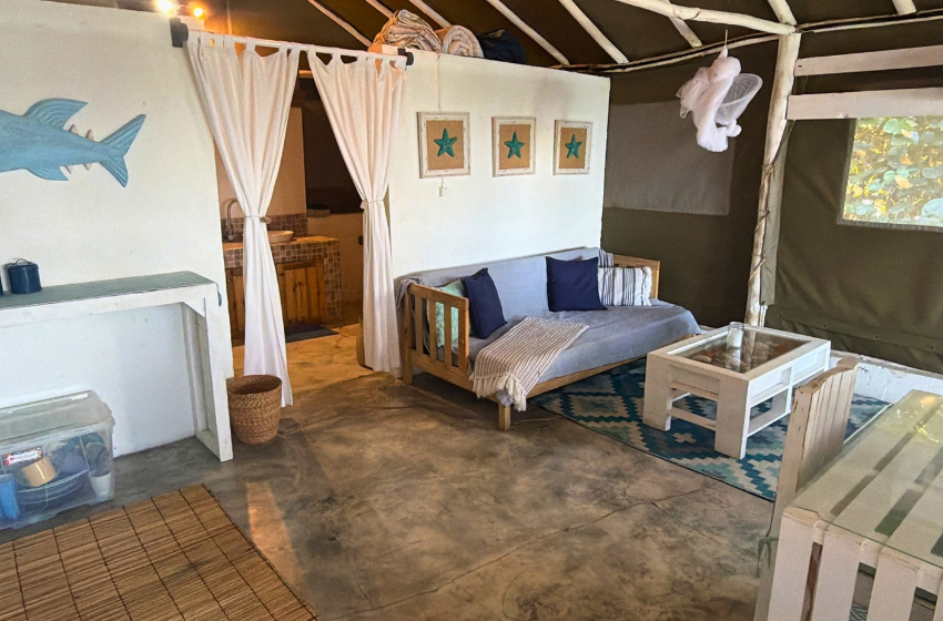 couch and coffee station at Baleia azul beachfront tent 7 in Ponta Mamoli
