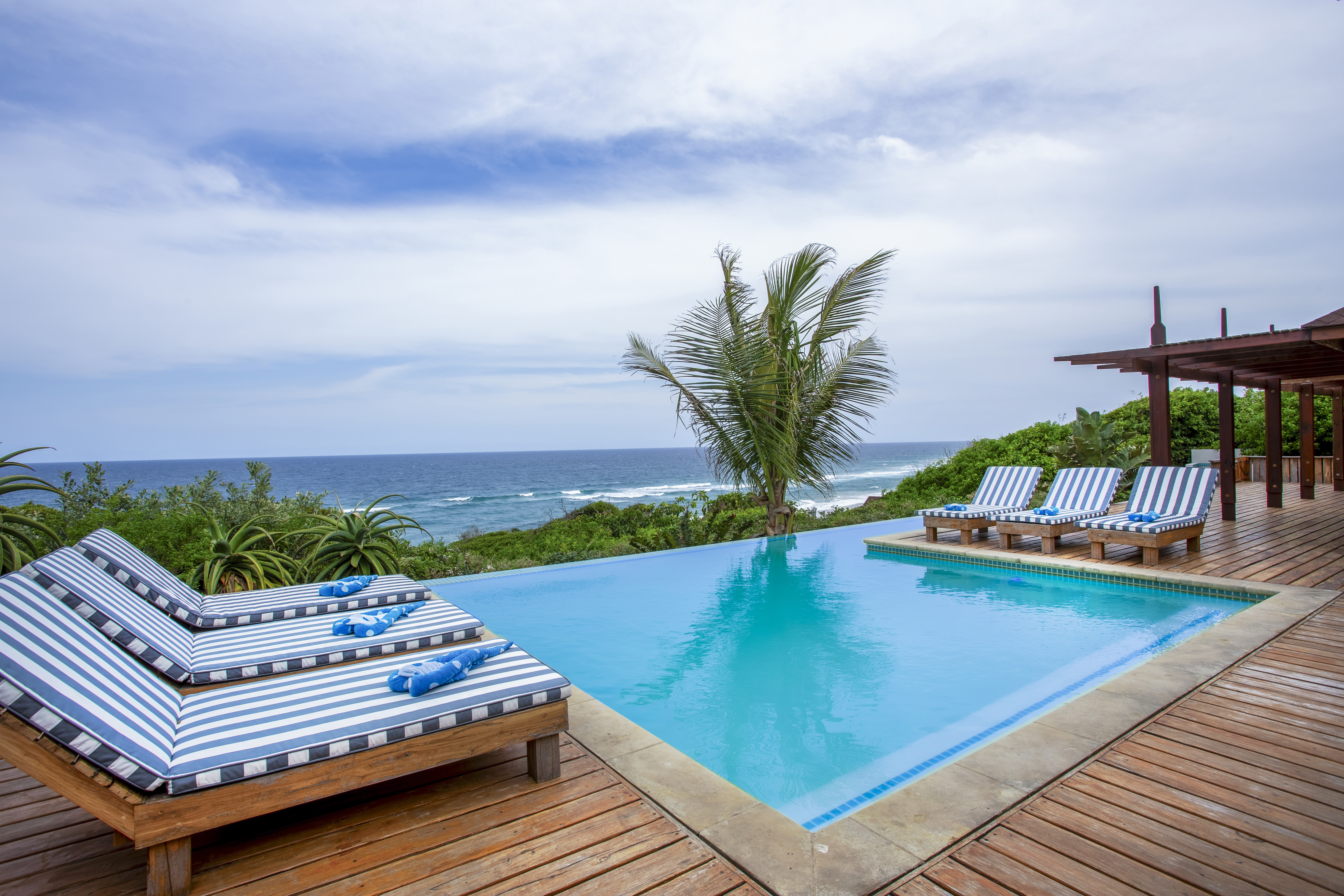 pool with sun loungers at Aloha 7 in Ponta Mamoli