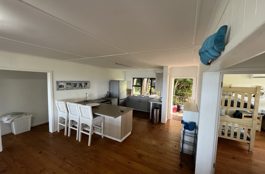 open plan kitchen with dining area at campismo ninho 28 in Ponta Malongane